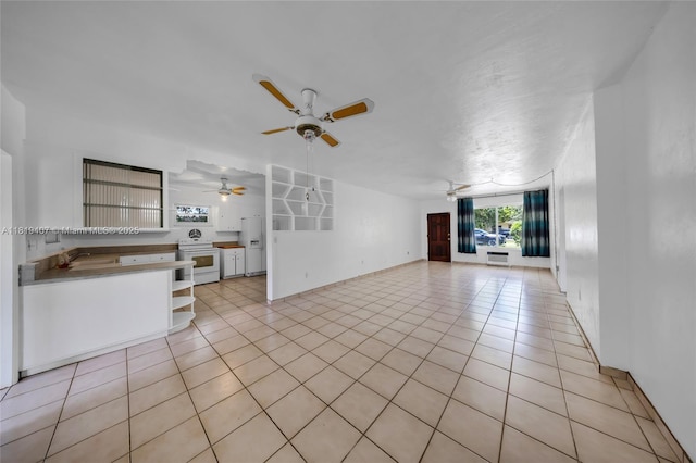 810 NE 119th St, Biscayne Park, FL 33161 - unfurnished living room with a ceiling fan and light tile patterned flooring