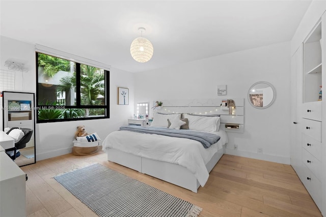 141 Crandon Blvd Unit 237, Key Biscayne, FL 33149 - bedroom with light wood finished floors