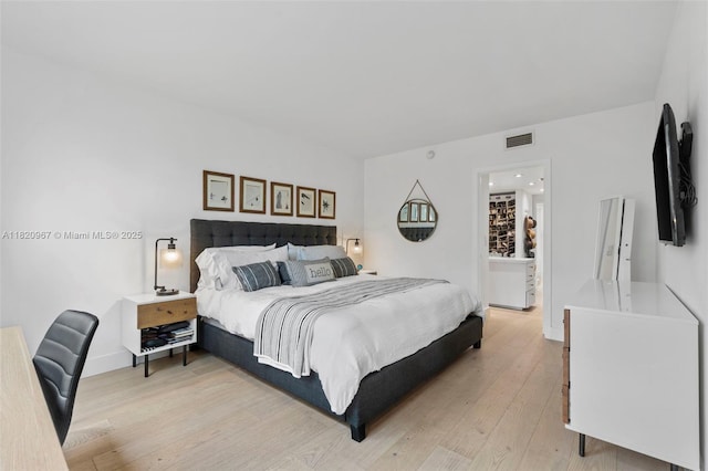141 Crandon Blvd Unit 237, Key Biscayne, FL 33149 - bedroom featuring light wood-style flooring and baseboards