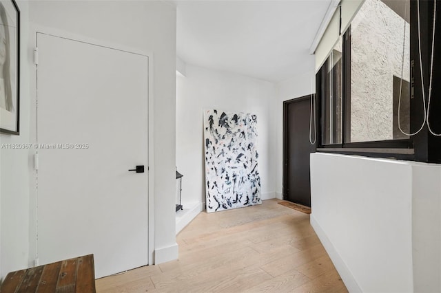 141 Crandon Blvd Unit 237, Key Biscayne, FL 33149 - corridor with light wood finished floors