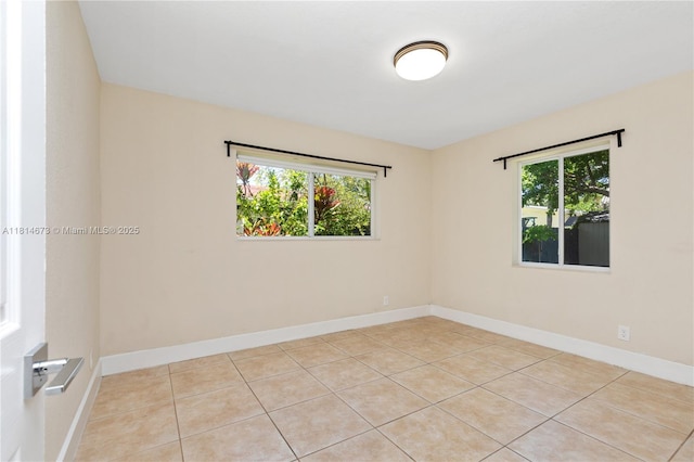 918 NE 6th St, Hallandale Beach, FL 33009 - tiled spare room with plenty of natural light