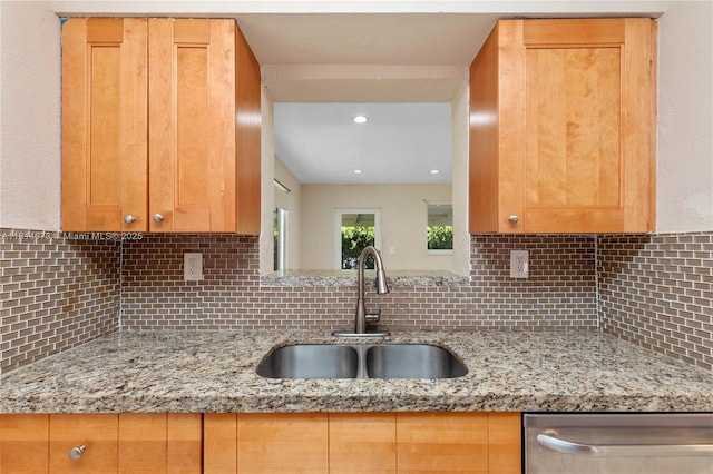 918 NE 6th St, Hallandale Beach, FL 33009 - kitchen with stainless steel dishwasher, tasteful backsplash, light stone countertops, and recessed lighting