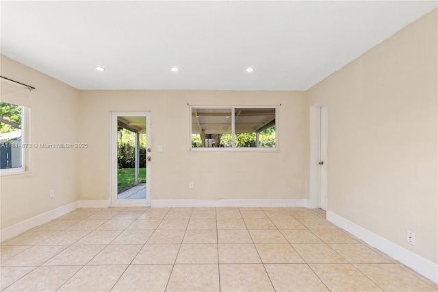 918 NE 6th St, Hallandale Beach, FL 33009 - empty room with plenty of natural light, recessed lighting, and light tile patterned floors