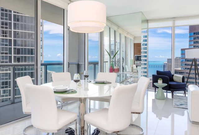 485 Brickell Ave Unit 3410, Miami, FL 33131 - tiled dining area featuring expansive windows, a water view, and a view of city