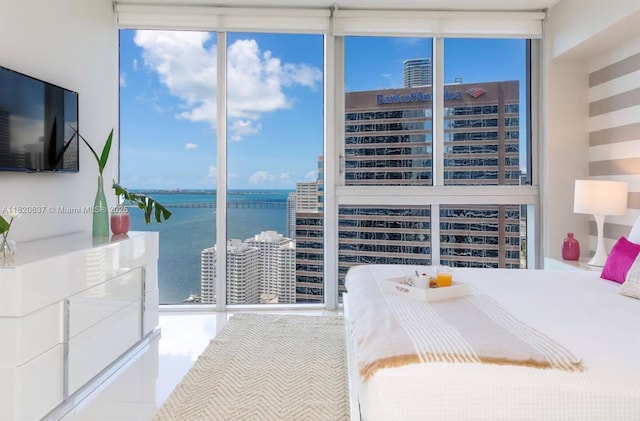 485 Brickell Ave Unit 3410, Miami, FL 33131 - bedroom with multiple windows, a water view, and expansive windows