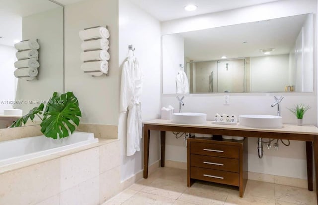 485 Brickell Ave Unit 3410, Miami, FL 33131 - bathroom with double vanity, a garden tub, a stall shower, tile patterned flooring, and recessed lighting