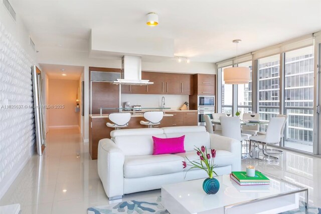 485 Brickell Ave Unit 3410, Miami, FL 33131 - living area featuring light tile patterned floors and rail lighting