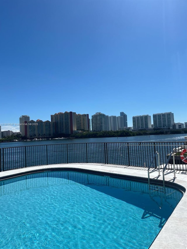 4000 NE 168th St Unit 110A, North Miami Beach, FL 33160 - view of pool featuring a skyline view and a water view