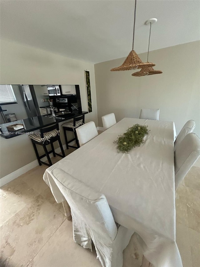 4000 NE 168th St Unit 110A, North Miami Beach, FL 33160 - dining space with baseboards