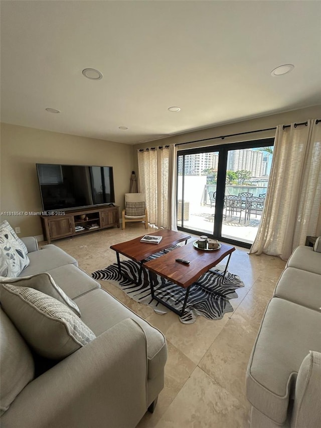 4000 NE 168th St Unit 110A, North Miami Beach, FL 33160 - living area with recessed lighting and light tile patterned floors