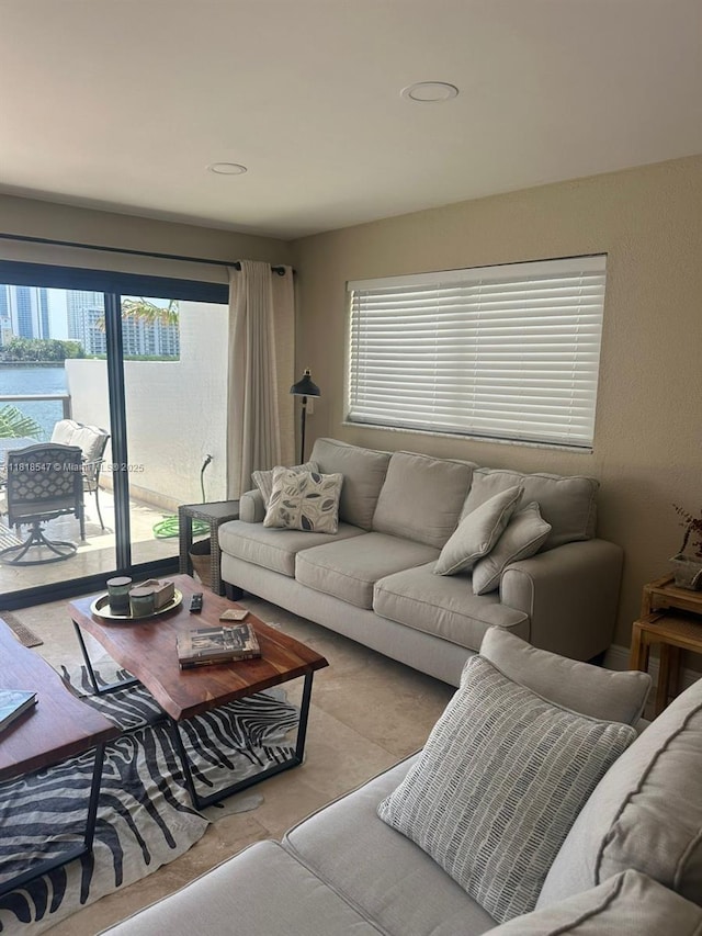 4000 NE 168th St Unit 110A, North Miami Beach, FL 33160 - living area featuring healthy amount of natural light and recessed lighting