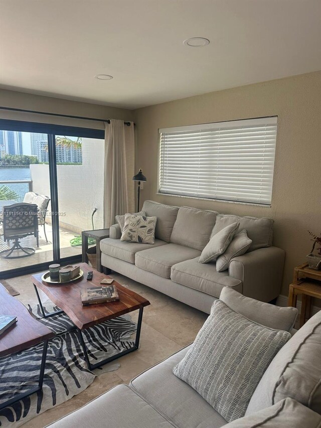 4000 NE 168th St Unit 110A, North Miami Beach, FL 33160 - living area featuring healthy amount of natural light and recessed lighting