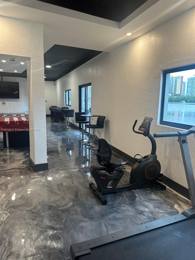 4000 NE 168th St Unit 110A, North Miami Beach, FL 33160 - workout room with a textured wall and recessed lighting