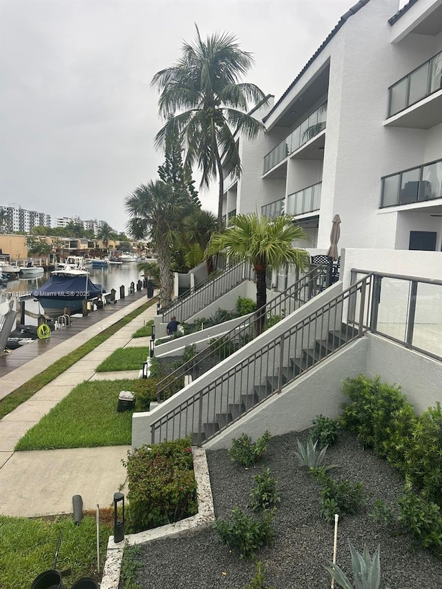 4000 NE 168th St Unit 110A, North Miami Beach, FL 33160 - surrounding community with a water view and stairway