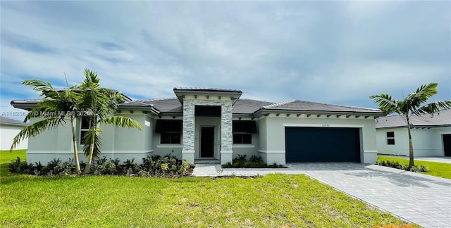 16932 SW 291st St, Homestead, FL 33030 - view of front facade with stucco siding, an attached garage, decorative driveway, a front yard, and a tile roof