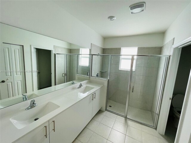 16932 SW 291st St, Homestead, FL 33030 - bathroom with double vanity, a shower stall, and tile patterned flooring