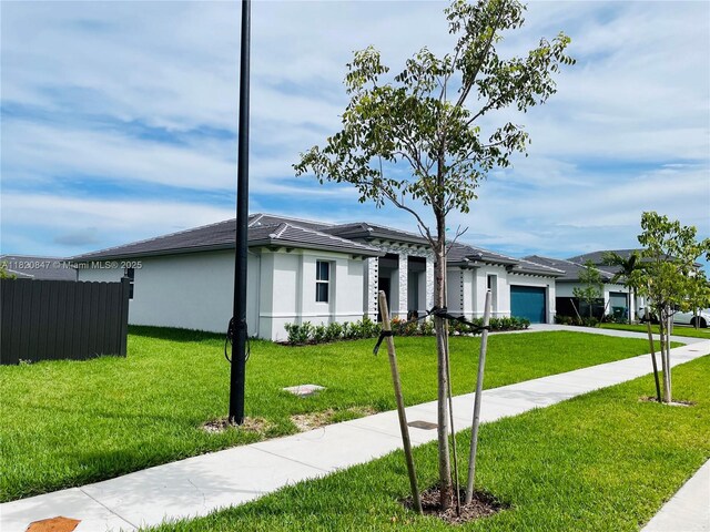 16932 SW 291st St, Homestead, FL 33030 - ranch-style home featuring an attached garage, concrete driveway, and stucco siding