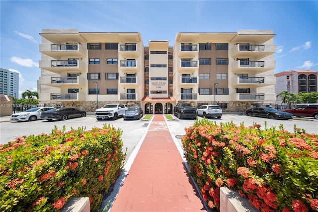5249 NW 7th St Unit 103, Miami, FL 33126 - view of apartment building / complex featuring uncovered parking