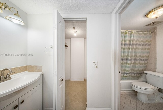 5249 NW 7th St Unit 103, Miami, FL 33126 - full bath featuring a textured ceiling, vanity, tile patterned flooring, and shower / tub combo with curtain
