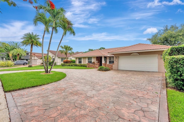 5655 NW 86th Ave, Coral Springs, FL 33067 - single story home with stucco siding, curved driveway, a tile roof, a front yard, and a garage