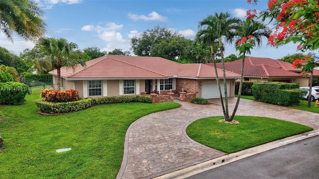 5655 NW 86th Ave, Coral Springs, FL 33067 - view of front facade featuring a tile roof, a front yard, curved driveway, stucco siding, and a garage