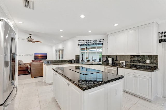 5655 NW 86th Ave, Coral Springs, FL 33067 - kitchen with stainless steel appliances, backsplash, recessed lighting, a ceiling fan, and a center island