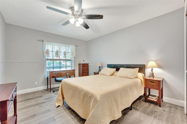 5655 NW 86th Ave, Coral Springs, FL 33067 - bedroom with light wood finished floors, a ceiling fan, and a textured ceiling