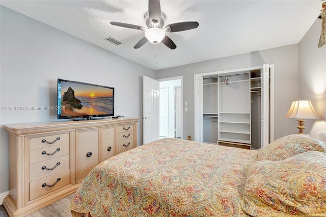 5655 NW 86th Ave, Coral Springs, FL 33067 - bedroom with a closet, light wood-style flooring, and a ceiling fan