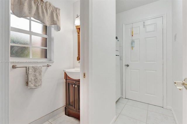 5655 NW 86th Ave, Coral Springs, FL 33067 - bathroom featuring tile patterned floors and vanity