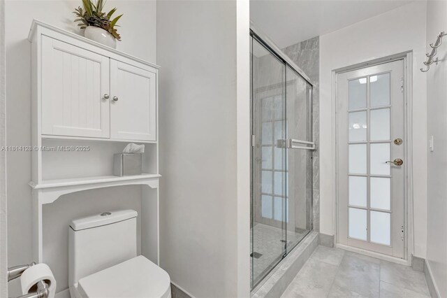 5655 NW 86th Ave, Coral Springs, FL 33067 - bathroom with a shower stall and tile patterned flooring