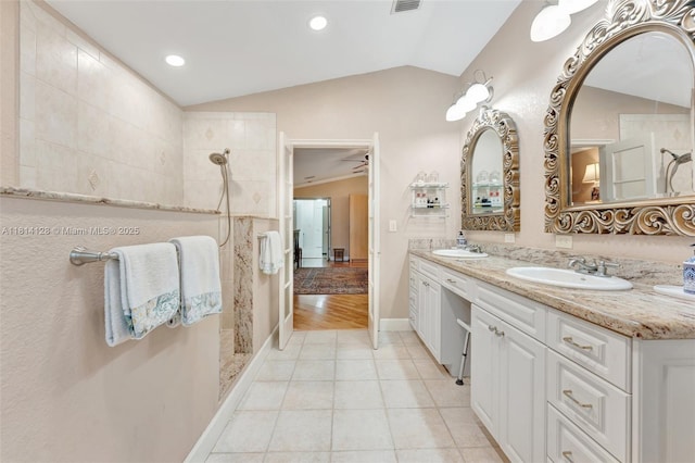 5655 NW 86th Ave, Coral Springs, FL 33067 - full bath featuring lofted ceiling, double vanity, a walk in shower, tile patterned flooring, and recessed lighting