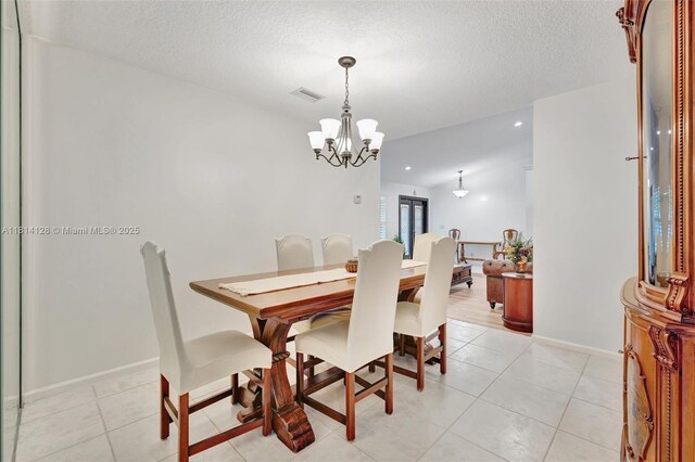 5655 NW 86th Ave, Coral Springs, FL 33067 - dining space with a chandelier, a textured ceiling, light tile patterned flooring, and recessed lighting