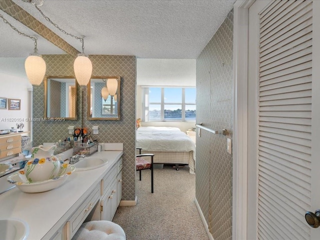 511 Bayshore Dr Unit 309, Fort Lauderdale, FL 33304 - full bathroom featuring ensuite bath, double vanity, a water view, and a textured ceiling