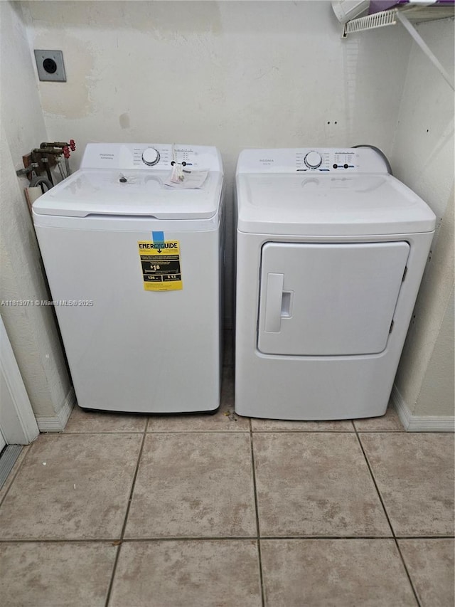 6711 N Kendall Dr Unit 505, Pinecrest, FL 33156 - laundry room featuring tile patterned floors and washing machine and clothes dryer