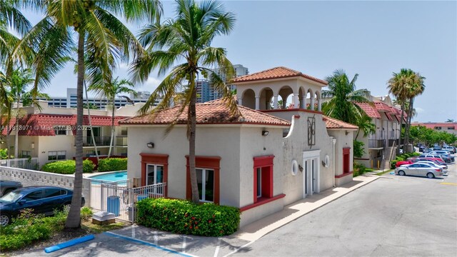 6711 N Kendall Dr Unit 505, Pinecrest, FL 33156 - view of building exterior featuring uncovered parking