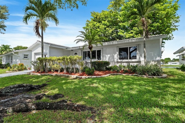 1081 NW 89th Ave, Plantation, FL 33322 - ranch-style house featuring an attached garage, a front yard, and stucco siding
