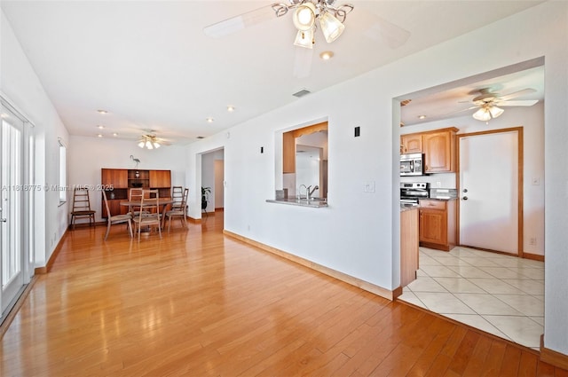 1081 NW 89th Ave, Plantation, FL 33322 - living room with ceiling fan and light wood-type flooring