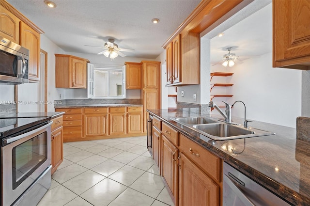 1081 NW 89th Ave, Plantation, FL 33322 - kitchen with ceiling fan, stainless steel appliances, light tile patterned floors, dark stone countertops, and a textured ceiling