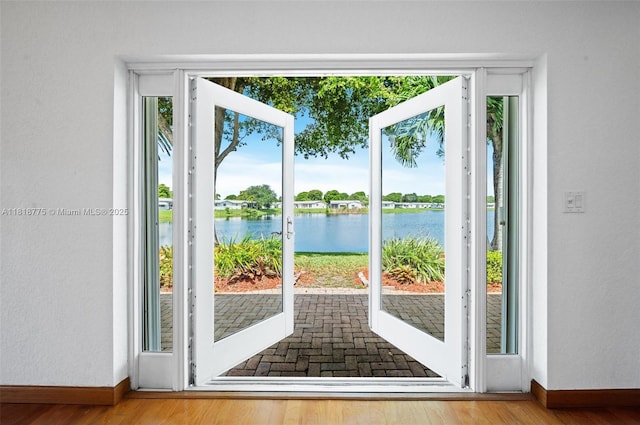 1081 NW 89th Ave, Plantation, FL 33322 - doorway with a water view and wood finished floors