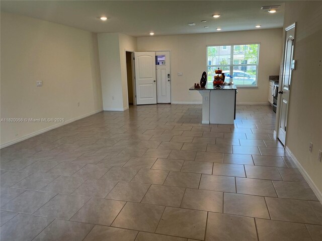 12035 Holystone St, Winter Garden, FL 34787 - unfurnished living room featuring baseboards and recessed lighting