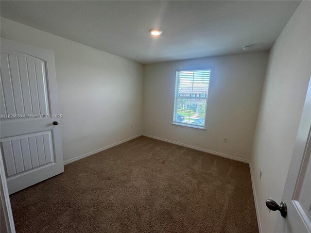 12035 Holystone St, Winter Garden, FL 34787 - carpeted empty room featuring baseboards