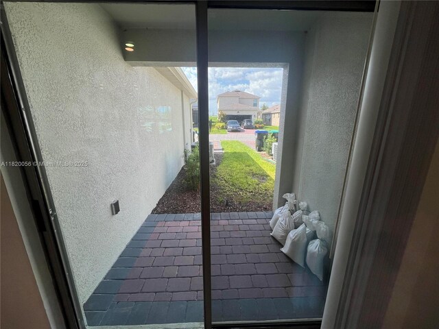 12035 Holystone St, Winter Garden, FL 34787 - entryway featuring a textured wall and tile patterned floors