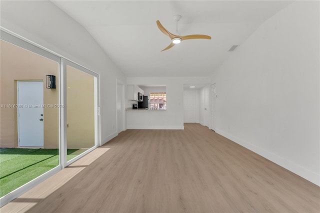 9550 W Heather Ln, Miramar, FL 33025 - unfurnished living room featuring light wood finished floors, ceiling fan, and lofted ceiling