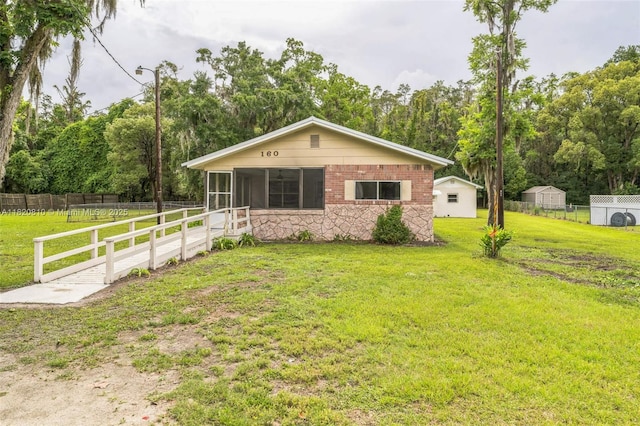 160 SW 9th Ave Fl, Lake Butler, FL 32054 - view of front of property with a sunroom and stone siding