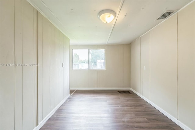 160 SW 9th Ave Fl, Lake Butler, FL 32054 - spare room featuring wood finished floors and a decorative wall
