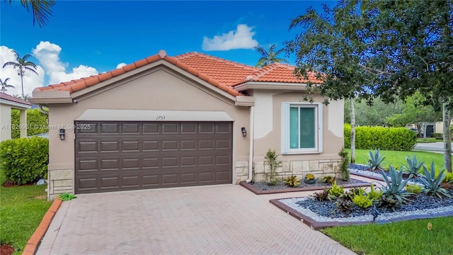 1753 Aspen Ln, Weston, FL 33327 - view of front facade featuring a garage, decorative driveway, a tile roof, and stone siding