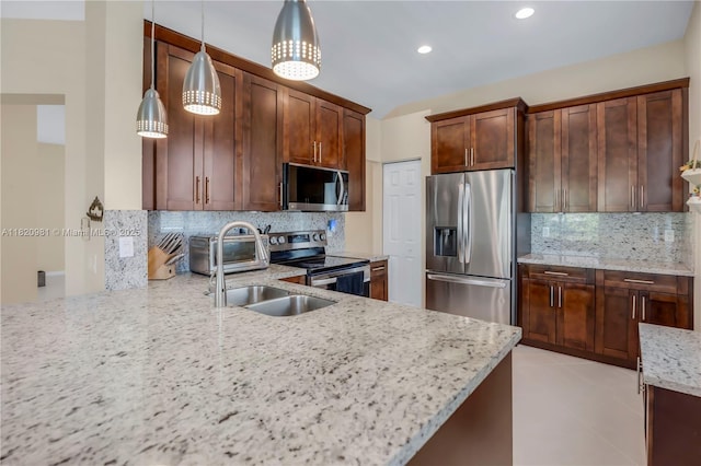 1753 Aspen Ln, Weston, FL 33327 - kitchen featuring stainless steel appliances, tasteful backsplash, light stone countertops, pendant lighting, and recessed lighting
