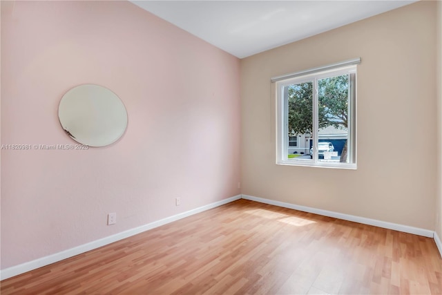 1753 Aspen Ln, Weston, FL 33327 - unfurnished room with baseboards and light wood-style flooring
