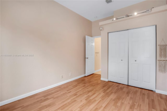 1753 Aspen Ln, Weston, FL 33327 - unfurnished bedroom featuring light wood finished floors and a closet