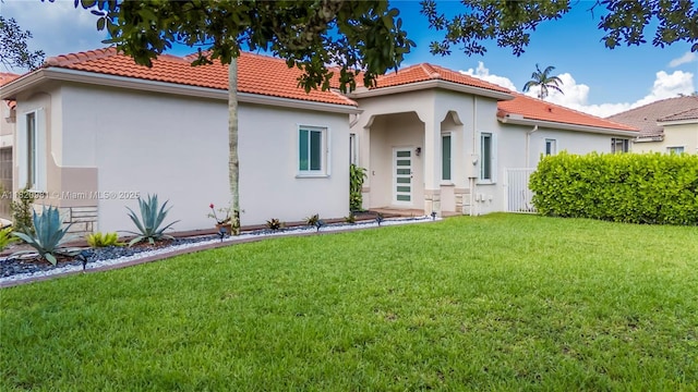 1753 Aspen Ln, Weston, FL 33327 - mediterranean / spanish home with a tile roof, stucco siding, and a front yard